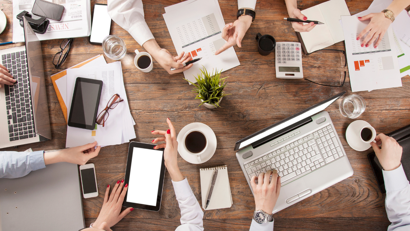 image of your team working collaboratively over laptops